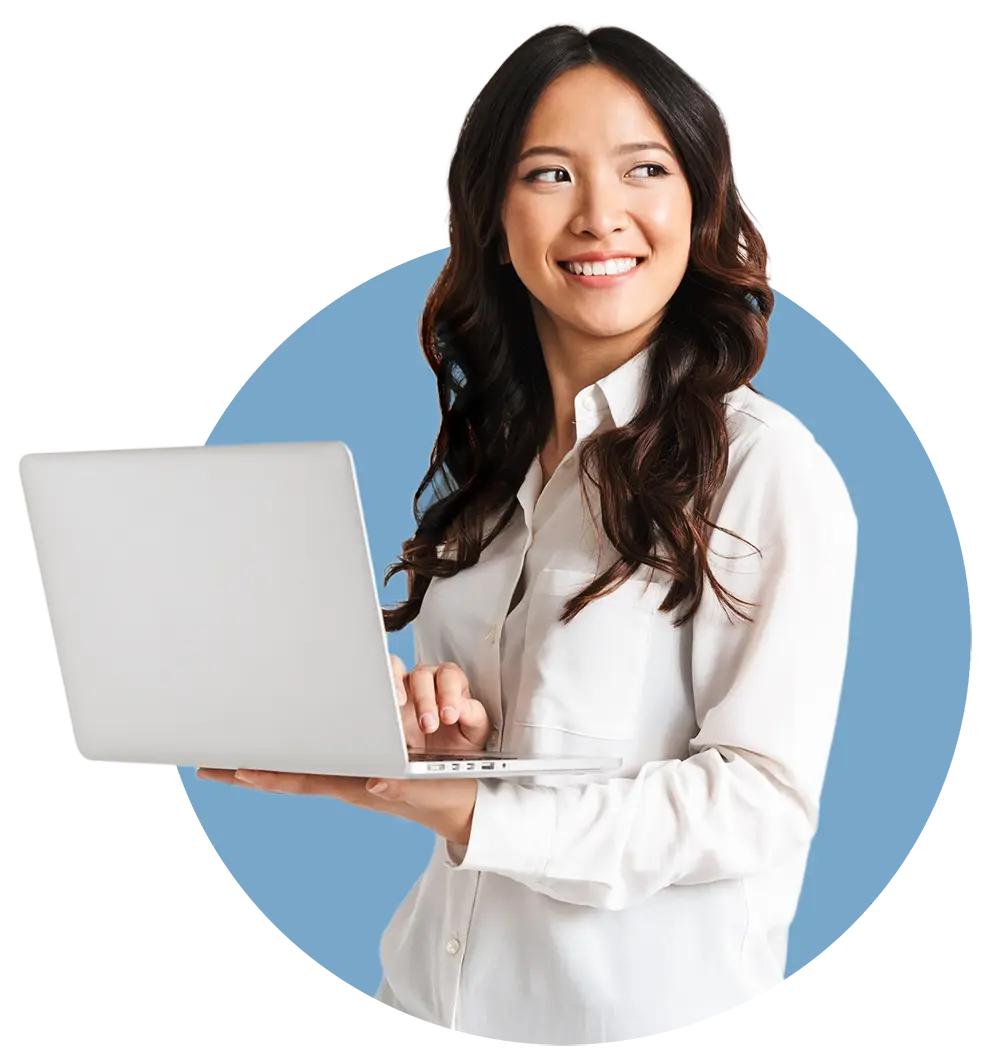 Woman holding a laptop with lease accounting software.